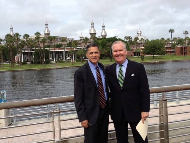 Officials including Mayor Bob Buckhorn at the June 2013 construction kickoff for the Kennedy Boulevard segment of the Tampa Riverwalk — the federally funded segment that connected the path end to end.