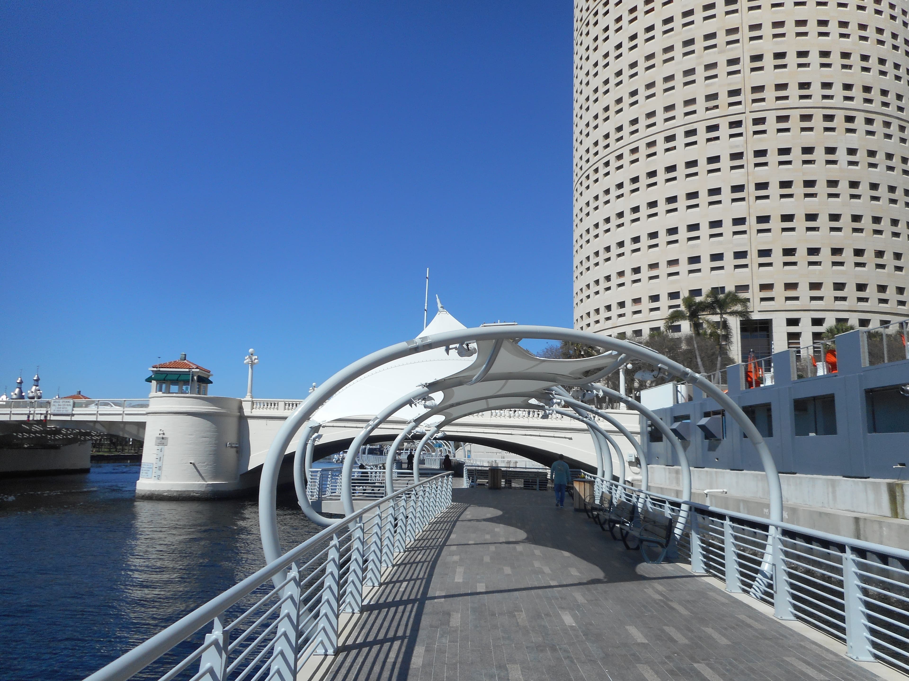 The Tampa Riverwalk at the Kennedy Bridge SE tunnel — pedestrian path along the Hillsborough River beneath the bridge.